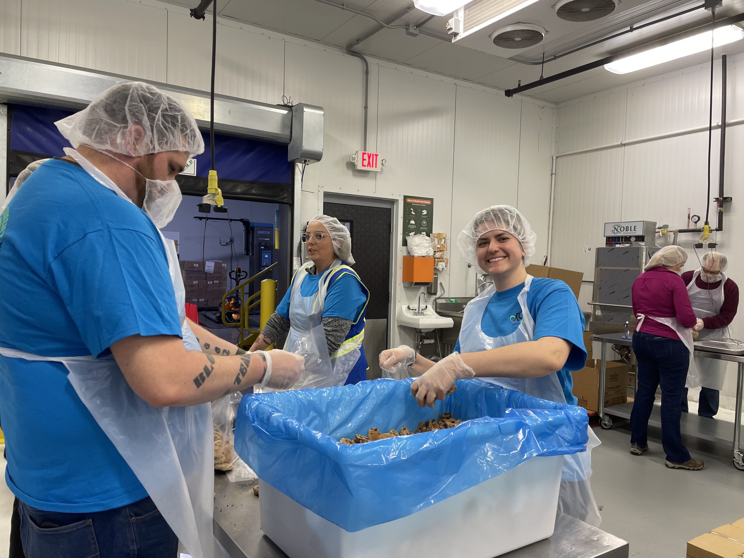 RGL teammates packaging cookies at Feeding America volunteer day