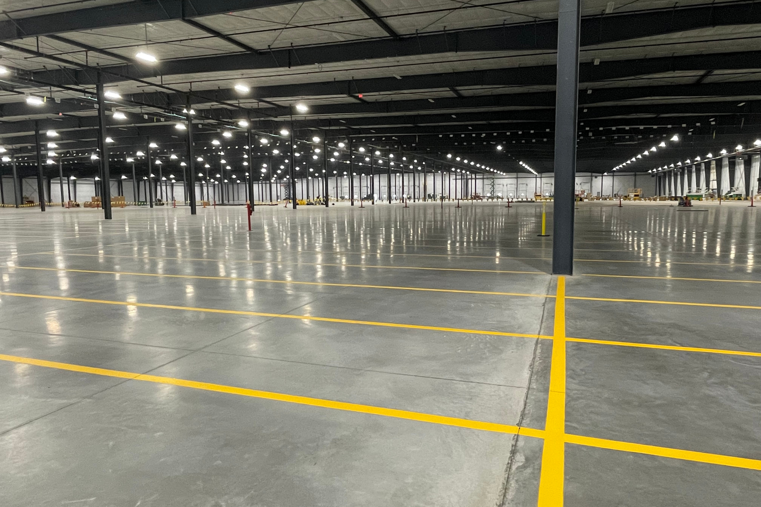 Interior view of RGL's Warehouse 80 in Appleton, Wisconsin, showcasing a spacious, well-lit, and empty storage area available for lease.